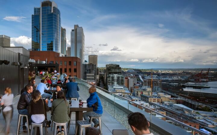 Patrons enjoying the rooftop of the Seattle event venue the Thompson Hotel