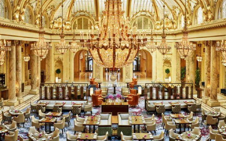 Gold accents all over the ballroom of the Palace Hotel in San Francisco where an event is set up