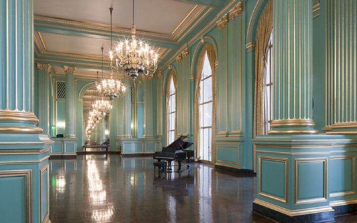 Gorgeous chandeliers and gold detailing in the Green Room at the San Francisco Performing Arts Center