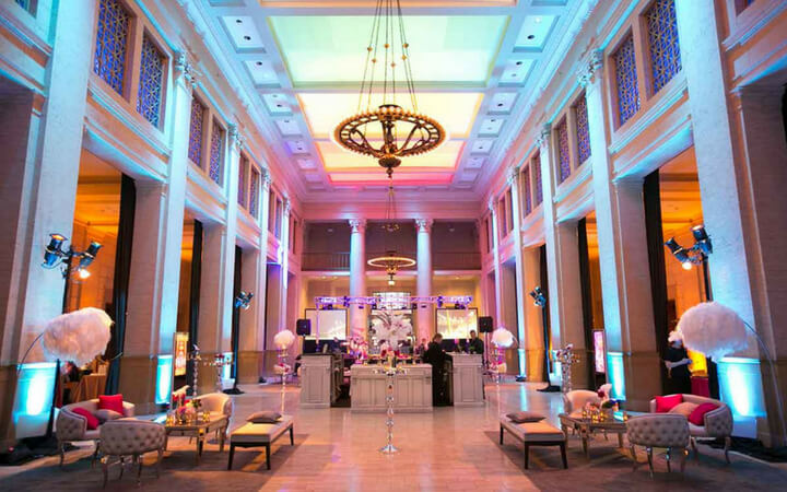 A gorgeous chandelier hangs from the high ceilings of Bently Reserve, a unique San Francisco event venue