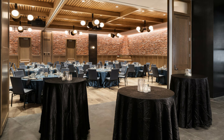 An event setup showcasing the sliding garage door of the Denver event venue the Maven Hotel 