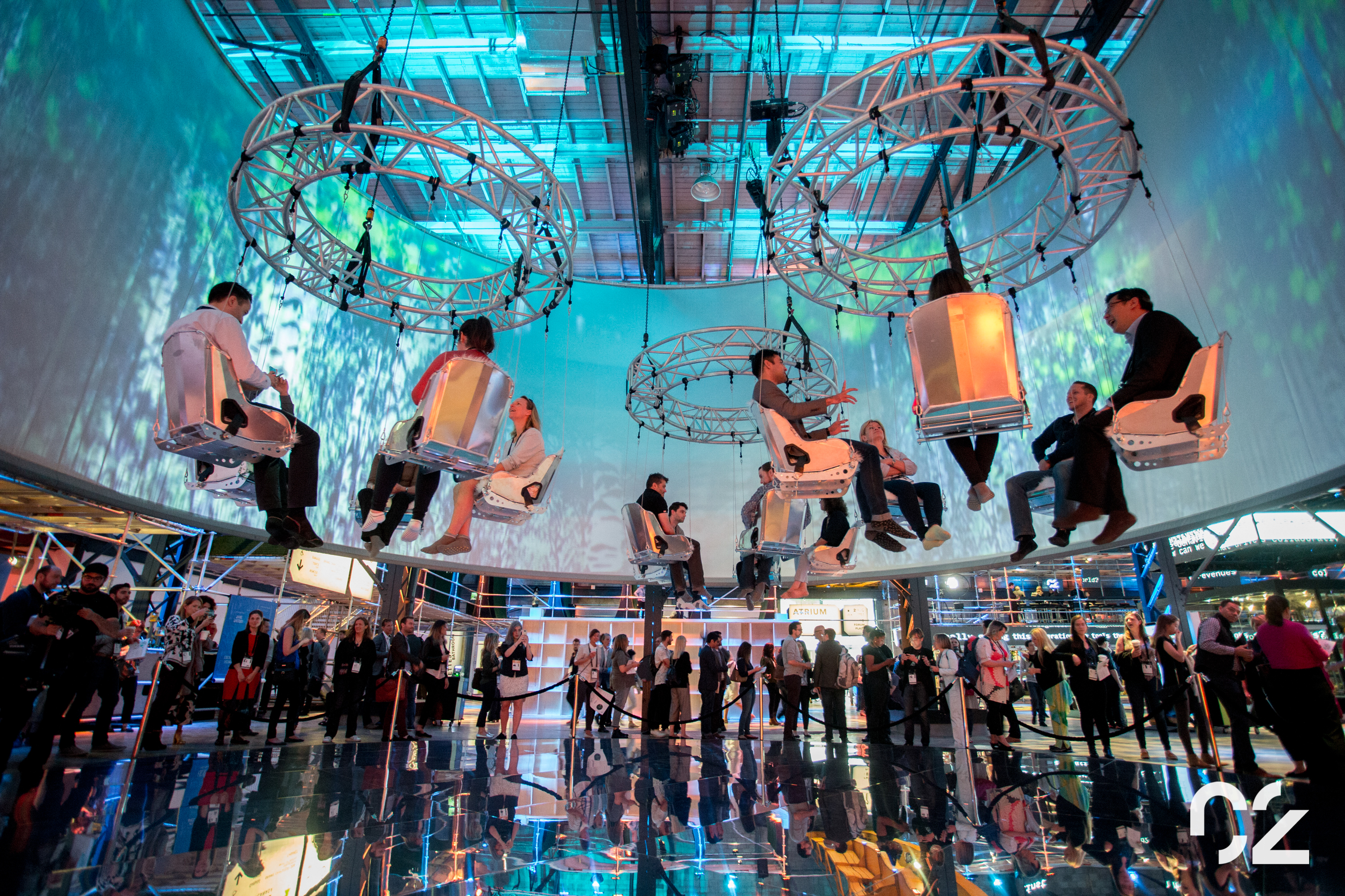 Hanging trapeze chairs at one the most innovative events in the meetings industry